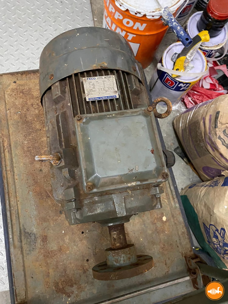 Old TECO Electric Motor with Rusted Flange Ready for Maintenance